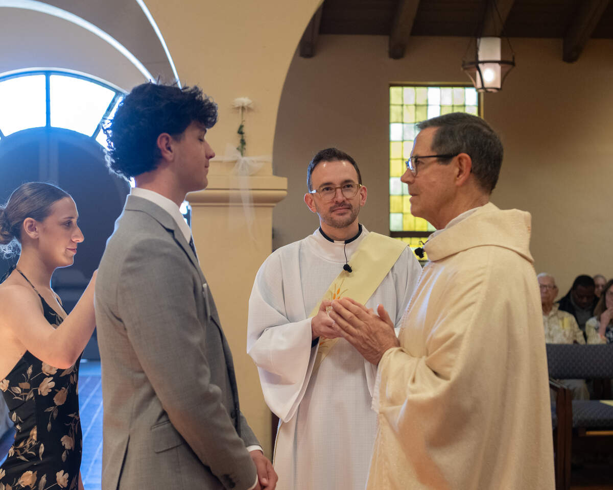 Teen with sponsor and priest