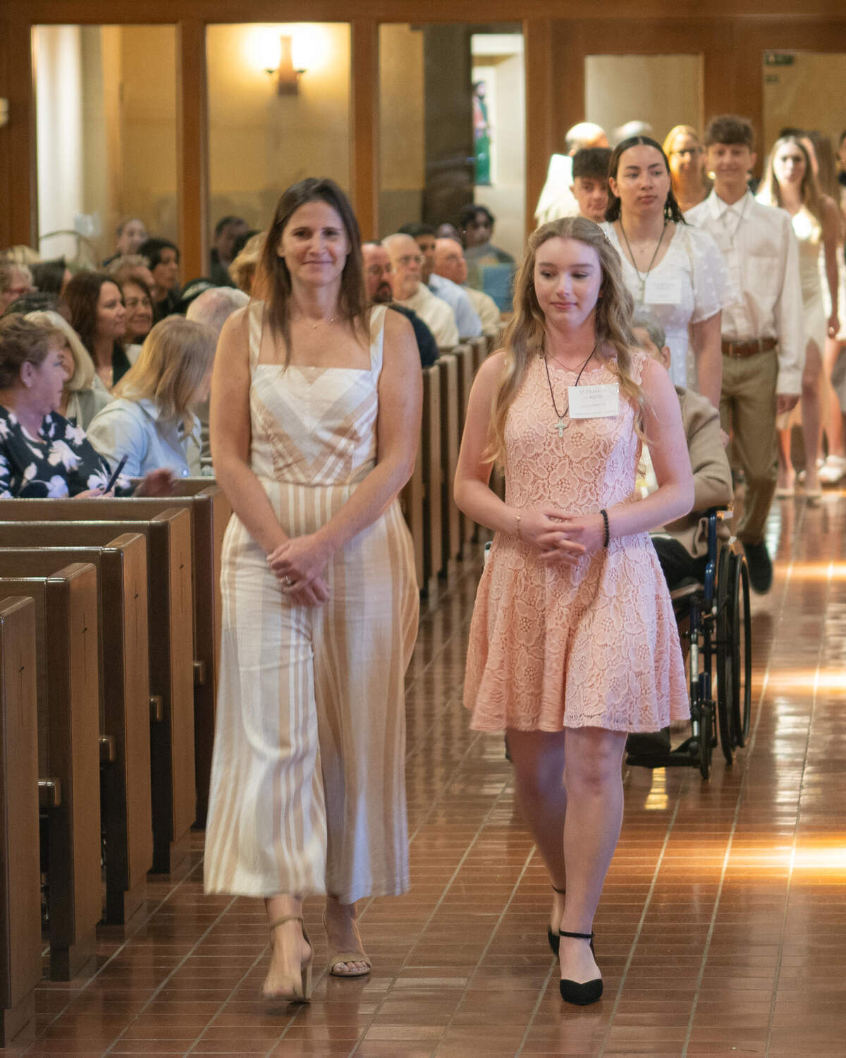 Confirmation candidates walking down the aisle